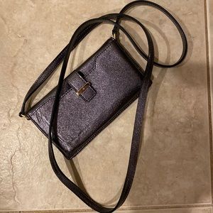 Kate Spade wallet with slot for phone and a strap